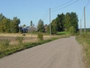 Gravel road and farms