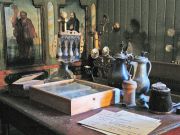 An hour-glass, an old bible, and other artifacts in a church museum